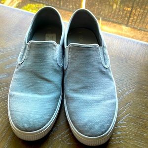Men’s grey slip on canvas shoes.